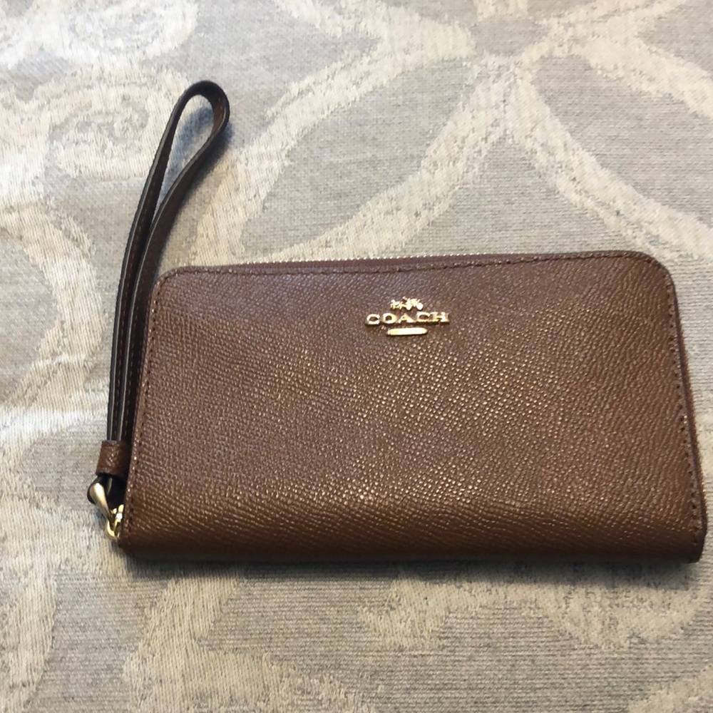 Coach brand wrist wallet. Caramel brown